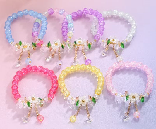 Handmade Bracelets Colorful beaded designs with delicate flower charms, handcrafted for a sweet, unique style.