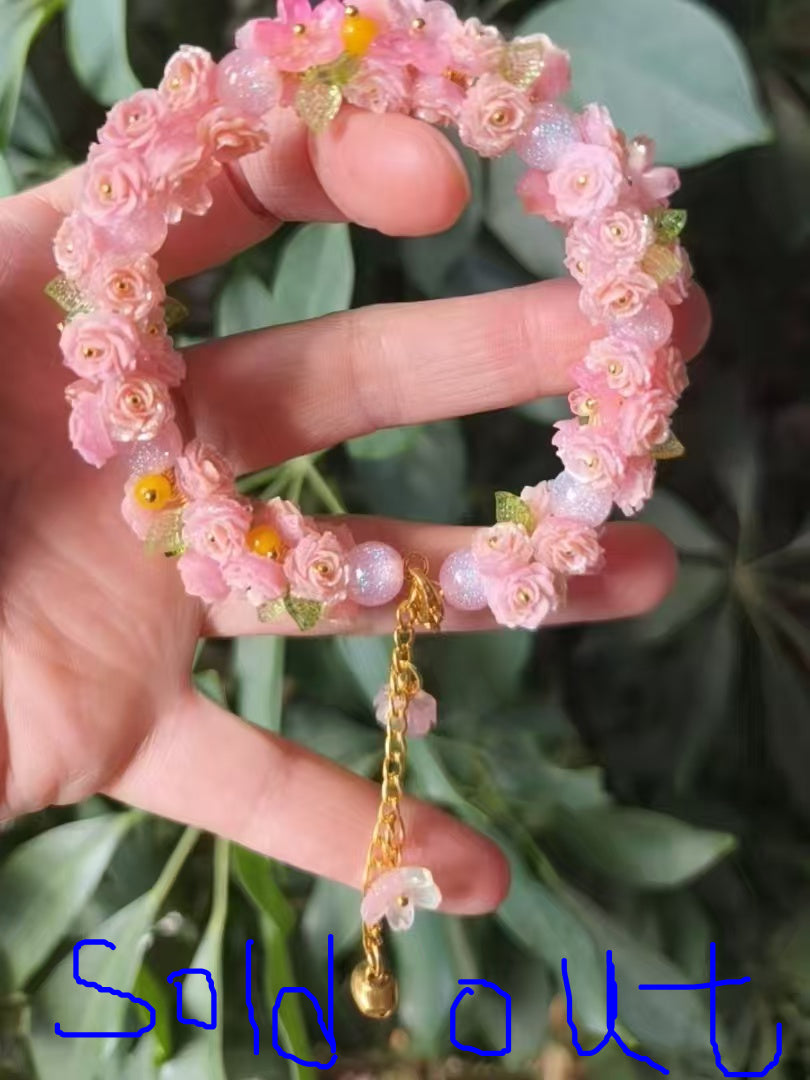 HandMadeBracelet-This pink flower sea bracelet features delicate resin flowers;