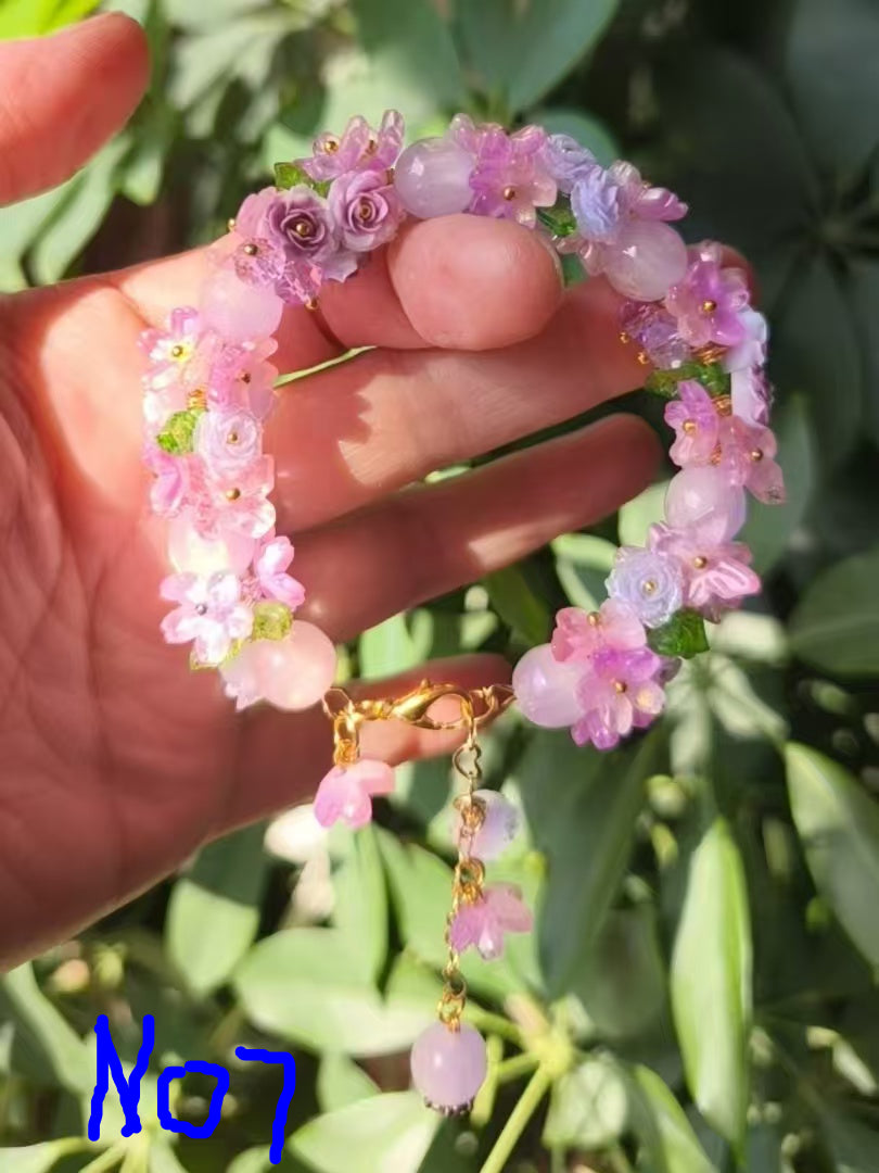HandMadeBracelet-This pink flower sea bracelet features delicate resin flowers;